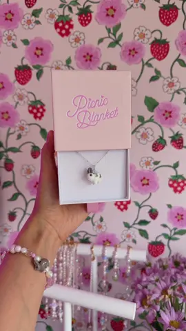 A post by @picnicblanketjewellery on TikTok caption: Let’s go behind the scenes of our magical custom bunny jewellery making process!🎀🐰✨ This is Sammy, let us know what you think in the comments below!💓🥹 #lampwork #custompet #petportait #picnicblanketjewellery 