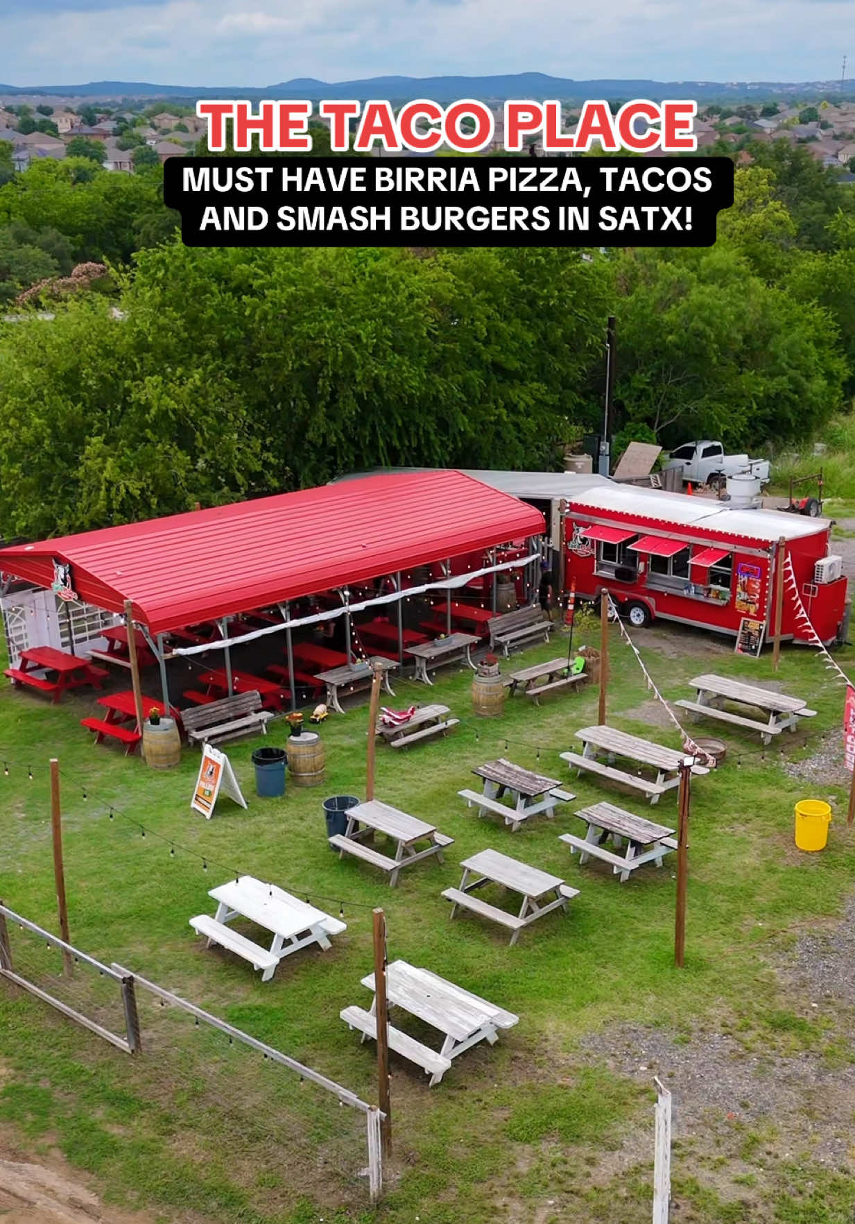 A post by @sanantoniofoodie on TikTok caption: @Thetacoplace has must-try birria pizzas, tacos, loaded fries — and now, Smashburgers! 🌮🍔 📍10915 Shaenfield Rd (BEHIND the church) ⏰ Thur: 5-10pm, Fri-Sat: 5pm-11pm #birria #tacotruck #sanantonio #sanantoniofood #satx 