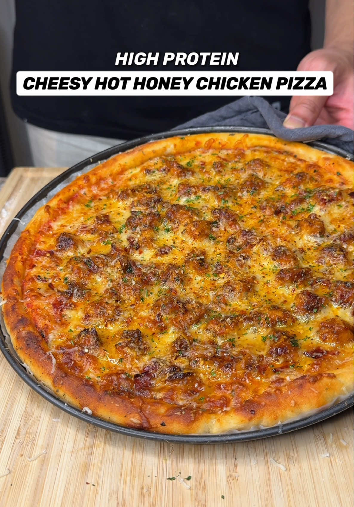 A post by @jalalsamfit on TikTok caption: High Protein Cheesy Hot Honey Chicken Pizza🍕🍯🍗 With nearly 100g of Protein, you can still enjoy an entire cheesy, delicious pizza and still lose weight🔥 Now that’s a game changer!🤌🏽 Macros Per 12 Inch Pizza (Makes 2 12” Pizzas) 916 Calories | 93g Protein | 62g Carbs | 33g Fat Ingredients (2 Pizzas) Protein Pizza Dough (makes 2 pizza bases) - 150g Plain Flour - 240g Fat Free Cottage Cheese, blended smooth - 3/4 Tsp Salt - 3/4 Tsp Garlic Powder - 1 Tsp Baking Powder - 1 Tsp Active Dry Yeast (Optional) Chicken & Seasonings - 360-400g Raw Chicken Breast, cut into extra small cubes - 1 Tsp Salt - 1.5 Tsp Oregano - 1 Tsp Chilli Flakes - 1.5 Tsp Garlic Powder - 1.5 Tsp Paprika - 1 Tsp Olive Oil Pizza Filling (Per Pizza) - 30-40g Tomato Passata or Pizza Sauce - Season with Oregano & Basil - 80g Light Shredded Mozzarella - Half of the Cooked Chicken - 30g Turkey Bacon, chopped up - 20-25g Grated Parmesan Cheese - Extra Basil, Oregano, Chilli Flakes Seasoning Garnish - Lightly Grated Parmesan Cheese - 15g Drizzle of Honey (Per Pizza) - Parsley, finely chopped • Mix all the dry ingredients first then add the blended cottage cheese. Mix till you get crumbly texture, lightly oil your hands then form into a big dough ball • Use a knife to split into 2 equal halves and make 2 balls • Lightly flour the surface then use a rolling pin to rollout the dough as thin as you can without tearing. Fold the edges to form and crust • Place on a lined pizza tray, use a fork to poke holes on the base, add your fillings then bake in a preheated oven at 225C / 440F for 7-8 mins till beautifully golden and crispy Find More Easy Delicious Recipes Like this in My Digital Cookbooks!👨‍🍳📕 . . . . #pizza #cheesepizza #hothoney #honey #chickenpizza #highprotein #weightloss #healthyrecipes #EasyRecipes #healthymeals #pizzadough #cottagecheese #fitness #jalalsamfit 
