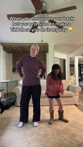 A post by @amandaseghetti on TikTok caption: My daughter has been asking to make a Boots on the Ground TikTok together — so on this rainy night we did it! Now for some ibuprofen and a heating pad. 🤣 My back isn’t what it used to be lol. #bootsontheground #momanddaughter 
