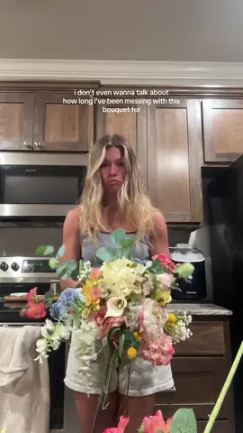 A post by @madisonlynge on TikTok caption: yall i am getting somewhere i think🙂‍↕️ #diybride #2025bride #bouquet #weddingbouquet #fauxflower #fauxflowerbouquet #fakeflowers #diyfakeflowers #hobbylobby #fyp #weddingdecor #bridalbouqet 