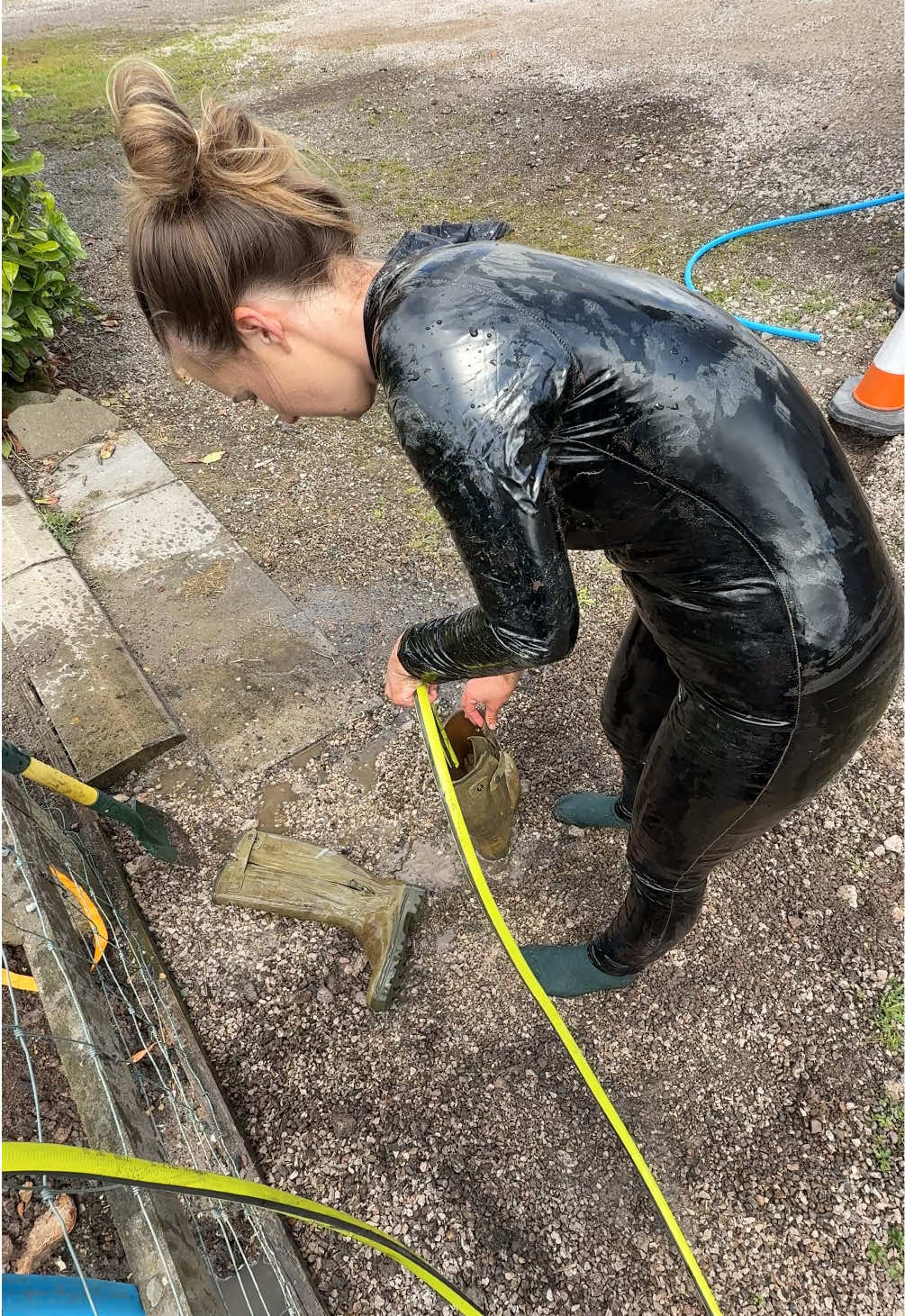 A post by @charlottelilyofficial on TikTok caption: How I clean up after a mud video. #wellies #mud #wam 