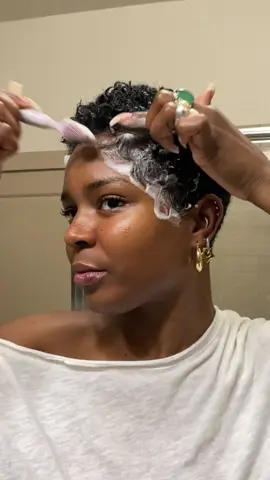 A post by @nymcfly on TikTok caption: Sometimes I have to go over the back of my hair cause I leave too much. This was that.  Mousse- @nyzroots.shop  #selfhaircut #shortnaturalhair #lowmaintenancehair 