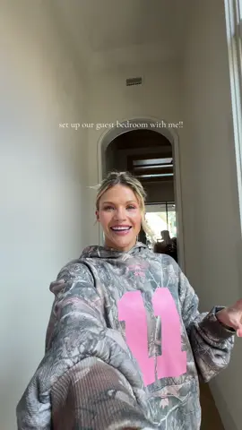 A post by @witneycarsonofficial on TikTok caption: Guys, my fam comes to visit tomorrow!! Yay! Get my guest bedroom ready with me 🥰😍🙏🏼 it turned out so pretty! Also, who’s our next guest?! #hosting #hostingideas #welcomebasket #family #guestbedroom 