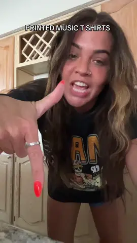 A post by @ash_lay on TikTok caption: printed music T-shirts ##tiktokshop