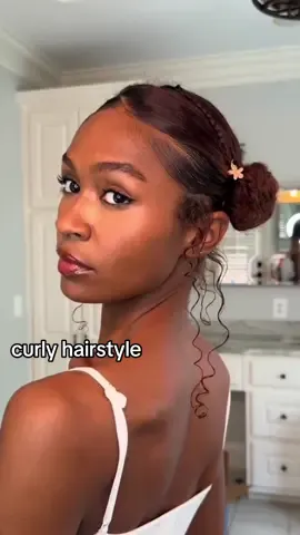 A post by @mailayazuri on TikTok caption: zigzag styles 🩷 #curlyhairstyles 