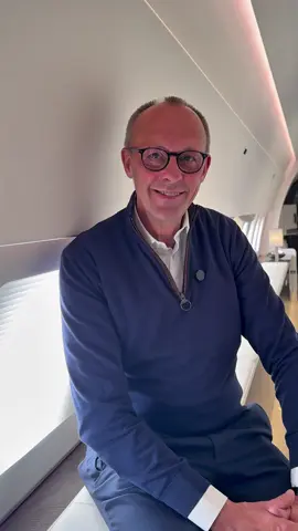 A post by @bundeskanzler on TikTok caption: Podcast im Regierungsflieger?  #Bundeskanzler #FriedrichMerz 