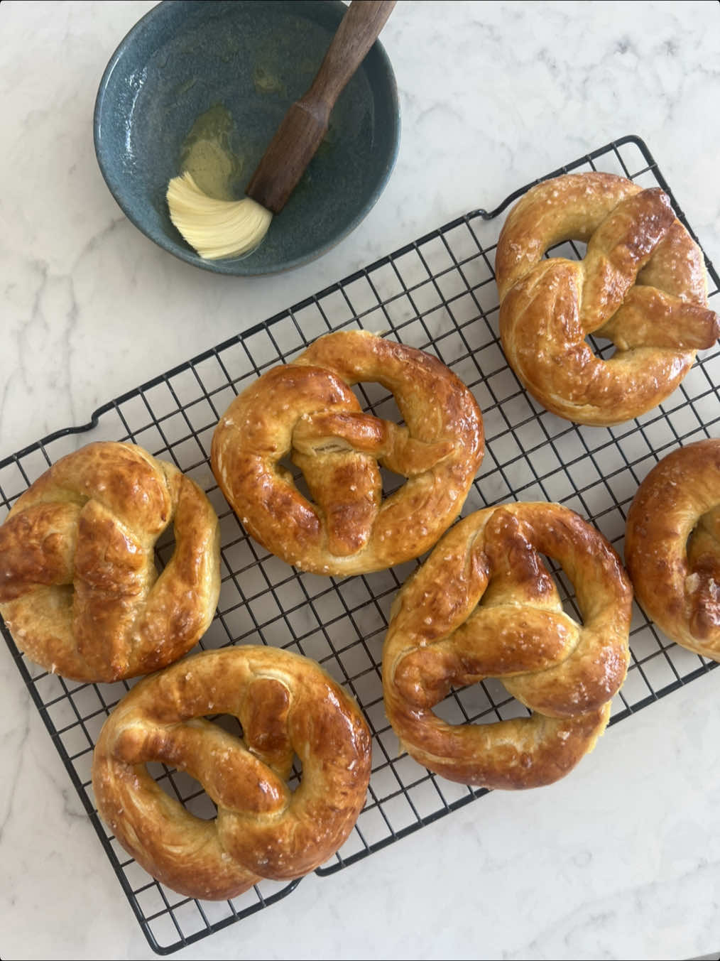 A post by @_lacebakes_ on TikTok caption: My daughter Sophie requested to make her favourite recipe from my book 🥨 The boys are at an airshow today, so it’s girl time for us and this girl always chooses to bake 💛  The pretzels are made using the sandwich bread dough recipe in my book 3 Doughs, 60 Recipes (page 113!). They rank in my top three favourite recipes from the book - try them!! 🥨 🥨🥨🥨🥨 #baking #bakingwithkids #softpretzels 