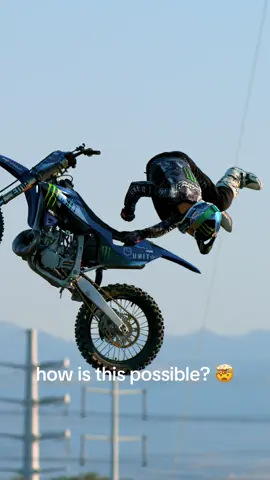 A post by @monsterenergy on TikTok caption: @TomRichards out here defying physics 😳 #MonsterEnergy #Moto #FMX #UnleashedAtX 