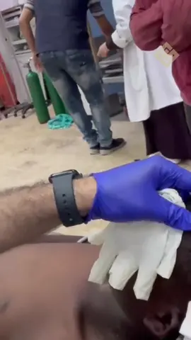 A post by @omarsuleimanofficial on TikTok caption: Israelis are playing a vile game of “Red Light, Green Light” at aid distribution sites, literally sniping Palestinians in the head, maiming and mutilating them. Dr. Adil Husain from Dallas just came back from Gaza and shared this distressing video of a young Palestinian shot in the head.