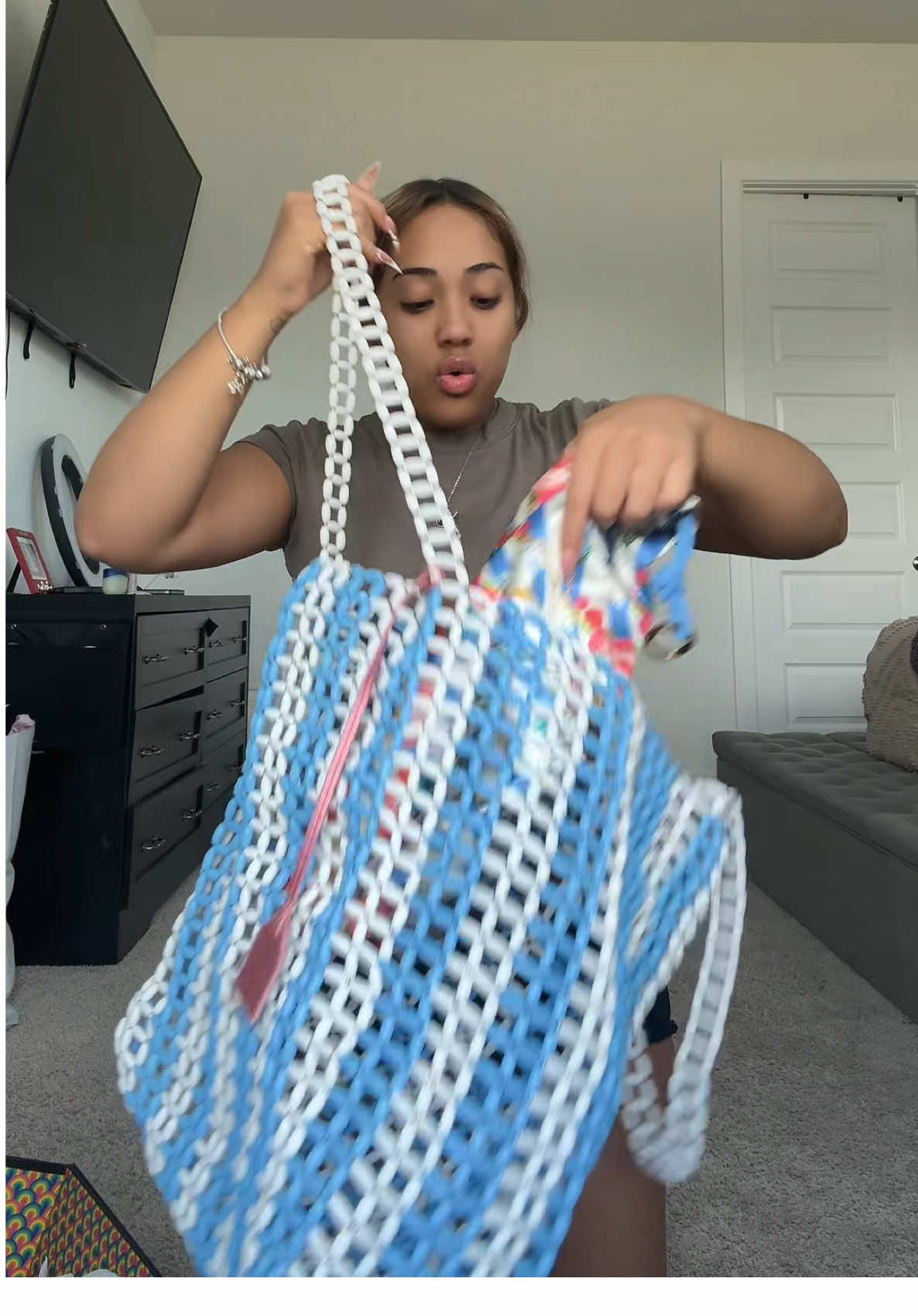 A post by @itssbriblixks on TikTok caption: @KURT GEIGER unboxing 😍😍😍 in love with this beach bag😆