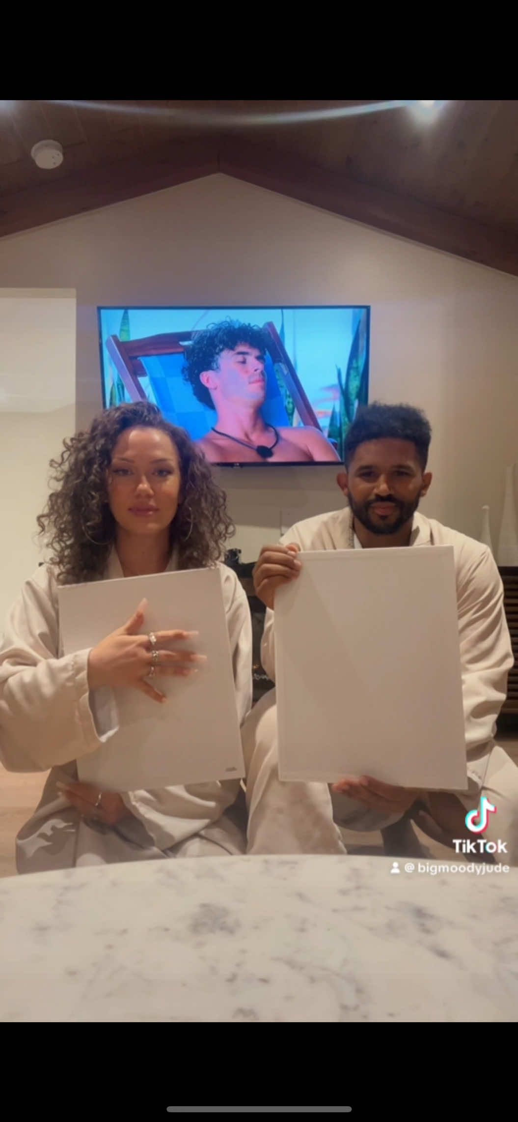 A post by @bigmoodyjude on TikTok caption: painting each other 🤝 love island 😅