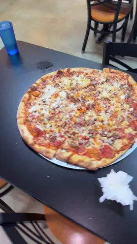 A post by @iluvceomomotion on TikTok caption: THE BIGGEST SLICE🫡 #food #foodtiktok #foodchallenge #hungry #mukbang #missouri #travel #Omw #blessed #pizza #pizzachallenge #live #liveforthechallenge #springfieldmo #fyp 