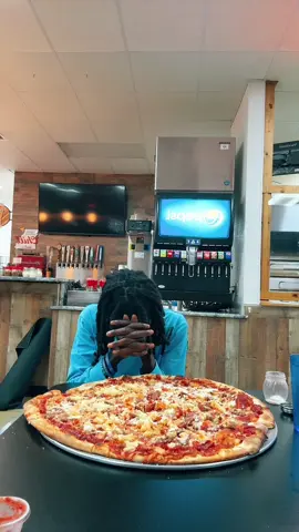 A post by @iluvceomomotion on TikTok caption: THE BIG SLICE PIZZA CHALLENGE😮‍💨 #food #foodtiktok #eating #foodchallenge #mukbang #travel #missouri #springfield #omw #traveltok #pizza #pizzachallenge #spedup #foodchallenges #cheese #hungry #spedup #voiceover #fyp 