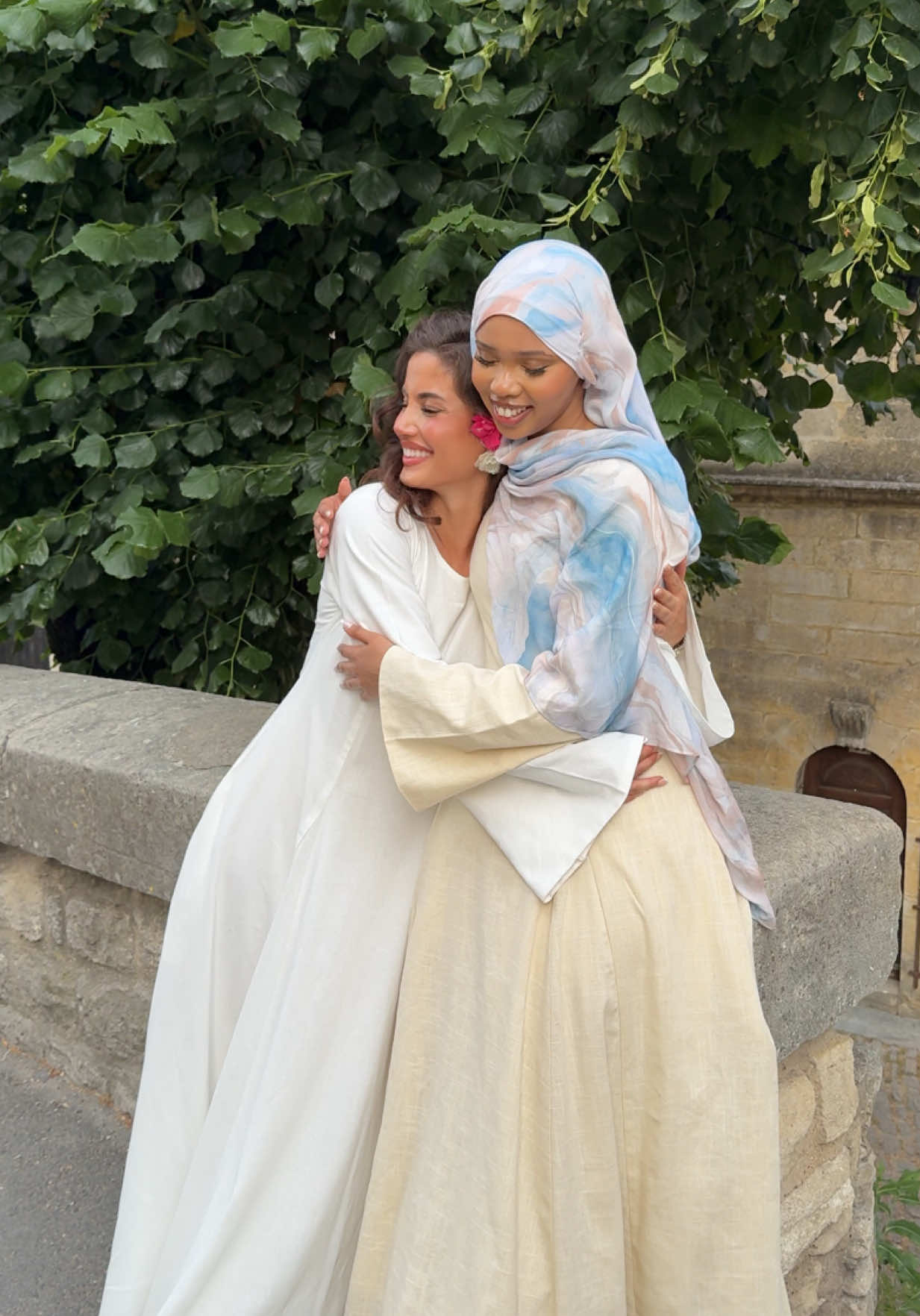 A post by @byhasanat on TikTok caption: White modest dresses >> Our White Linen Dress, Luna Chiffon Dress and Floral Lace Abayas (Yellow, Blue and Sage) will be launching July 1st at 12pm BST!✨ #summer #southoffrance #modest #modestfashion #hijab #modest #hijaboutfit #girls #girlstrip 