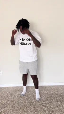 A post by @iamdwoodsx on TikTok caption: W or L fit?? 🤔🤔 Shirt available online. 4 color ways. Link in bio to order> 
