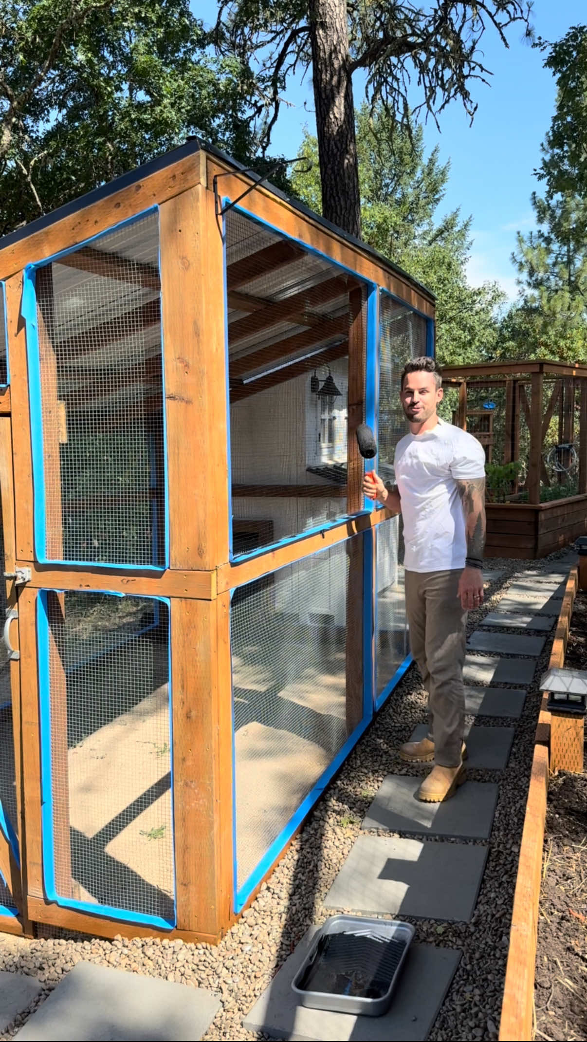 A post by @dadsocial on TikTok caption: I honestly didn’t think this would work either… but look at that, painting your fence black really does make it look more or less “invisible”. What should I try to do to my chicken coop or yard next?!? #DIY #chickencoop #farming 