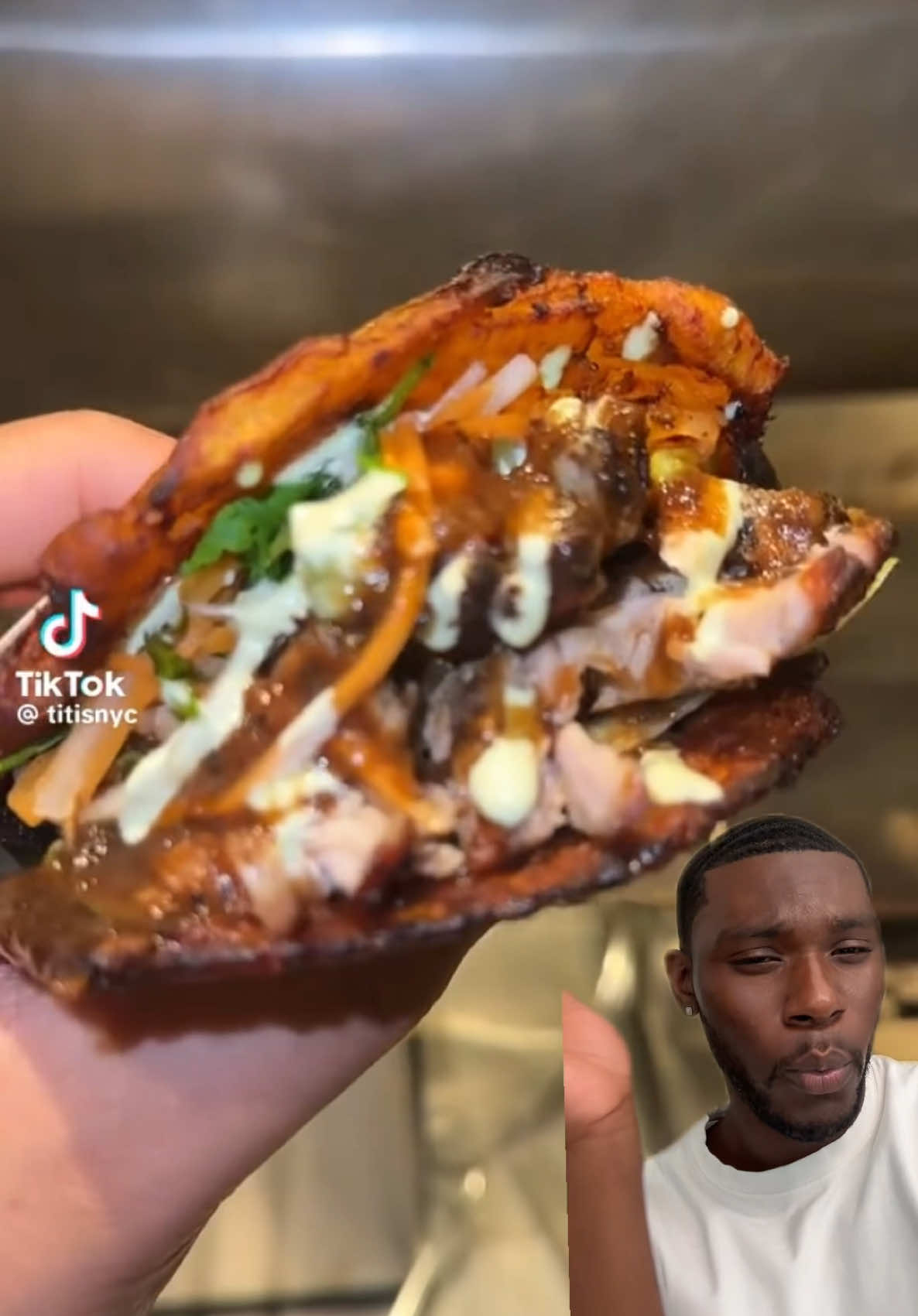 A post by @tyshonlawrence on TikTok caption: I had to run to this place called Titi’s in nyc to try this jerk chicken patacon and y’all…..