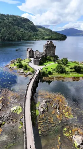 A post by @castlesofscotland on TikTok caption: Eilean Donan Castle overlooks the Isle of Skye, at the point where three great sea-lochs meet. Bishop Donan chose the tranquil spot back in 634AD to settle on and create a monastic cell. The first castle was later established in the 13th century by King Alexander II in an effort to help protect the area from Vikings who raided, settled and controlled much of the North of Scotland and the Western Isles between 800 and 1266. From the mid 13th century, this area was the quite seperate “Sea Kingdom” of the Lord of the Isles where the sea was the main highway and the power of feuding clan chiefs was counted by the number of men and galleys or “birlinns” at their disposal. Eilean Donan offered the perfect defensive position. War came to Eilean Donan during the Jacobite Rebellion of 1719. Britain had gone to war with Spain in 1718, and Spain saw a chance to destabilise Britain by inciting another Jacobite Rebellion. In April 1719 a small Spanish force under George Keith, Earl Marishcal landed first on the Isle of Lewis and then at Loch Alsh making Eilean Donan Castle their headquarters. With the support of numerous clans, including Clan Mackenzie and Clan MacGregor, the army proceeded inshore in an attempt to incite more Clans to rally to their cause. However, their absence was timely as on 10 May 1719 a Royal Navy detachment attacked the castle, launching a heavy bombardment that forced the garrison to surrender. Following this, Eilean Donan lay in silent ruin for the best part of two hundred years. The castle we see today was reconstructed as a family home between 1912 and 1932 by Lt Col John MacRae-Gilstrap, and opened to the public in 1955. Eilean Donan has also made several appearances in films including Highlander (1986), James Bond: The World Is Not Enough (1999), and Elizabeth: The Golden Age (2007) to name a few. #scotland #castle #history #travel #fyp #castles #scottishhighlands #outlander #beautifuldestinations #explore #traveltiktok #braveheart #castlesofscotland #scottish #scottishtiktok #bucketlist #magical #historytime #historytok #visitscotland 