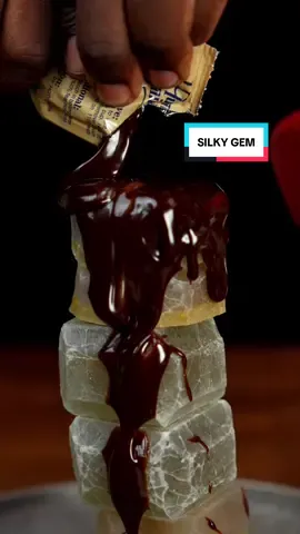 A post by @cozyivn on TikTok caption: 🗣️#RAMFAM lets try more @Silky Gem Crystal Candy candy! These were soooooo good! The pistachio in the middle made this taste so much better! And the chocolate sauce obviously makes everything taste good! So #Satisfying 🙏
