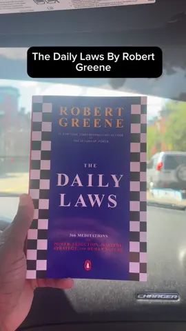 A post by @shaq_mair44 on TikTok caption: Your mind is your most valuable asset train it daily. The Daily Laws by Robert Greene gives you timeless wisdom in just one page a day. Success isn’t luck, it’s strategy. Start your transformation today. #BookTok #TheDailyLaws #RobertGreene #DailyWisdom #SelfMastery #MentalDiscipline #SuccessHabits #levelup #readtolead #MindsetShift #BookRecommendation 