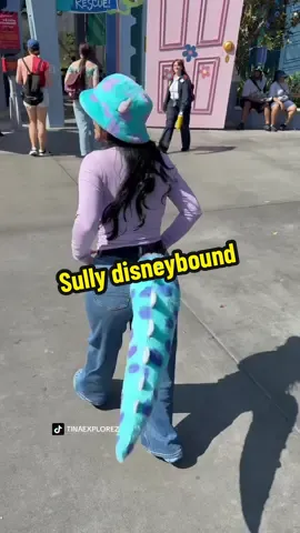 A post by @tinaexplorez on TikTok caption: I really hope they don’t get rid of the Monsters Inc ride #fyp #viralvideo #viral #ootd #disneybound #sully 