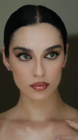 A post by @minazibayi on TikTok caption: Following Alexa demie’s vogue make up tutorial….🐈‍⬛🐈‍⬛🐈‍⬛…  . . . . . #alexademiemakeup #euphoria#fyp 