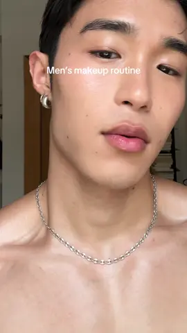 A post by @theedwardpark on TikTok caption: Current natural makeup routine! Something to enhance the features while feeling lightweight. Products used:  @Saie Glowy Supergel (warmglow), @Hourglass Cosmetics Veil Hydrating Skin Tint (5), @Fenty Beauty matchstix (Amber), Saie Dew Bronze (Sand), @chanel.beauty Lip & Cheek (Red Camelia), @REFY Brow Pencil, Hourglass Veil Setting Powder, @laneige_us lip mask #mensmakeup #boymakeup #naturalmakeup #summermakeup #glowymakeup 