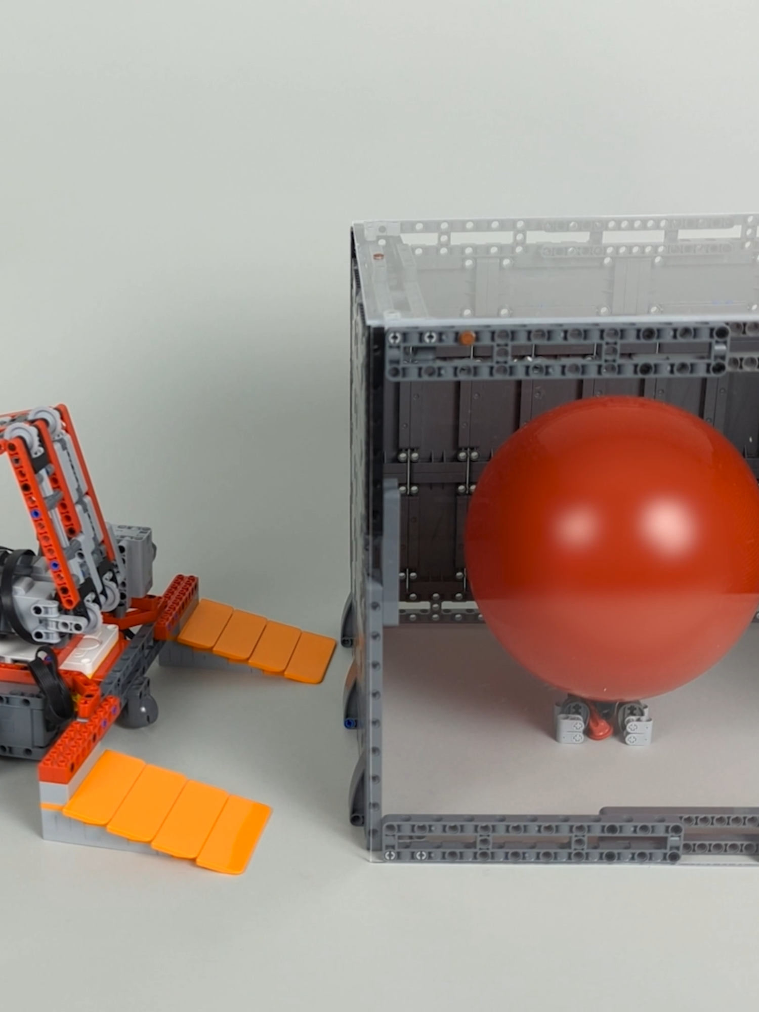 A post by @beyondthebrick on TikTok caption: Can a LEGO Car Pop Balloons? Video by Brick Machines #lego