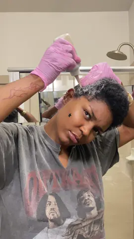 A post by @nymcfly on TikTok caption: Hair dets🫶🏾 Styling mousse linked in my bio @nyzroots.shop  #shortnaturalhair #hairlightening #pixiestyle #brownhairbrownskin #honeybrownhair 