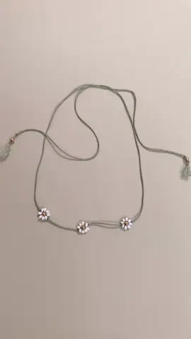 A post by @valentinabalance on TikTok caption: How to make Daisy #firendship bracelets necklaces #diy #summer #giftideas 
