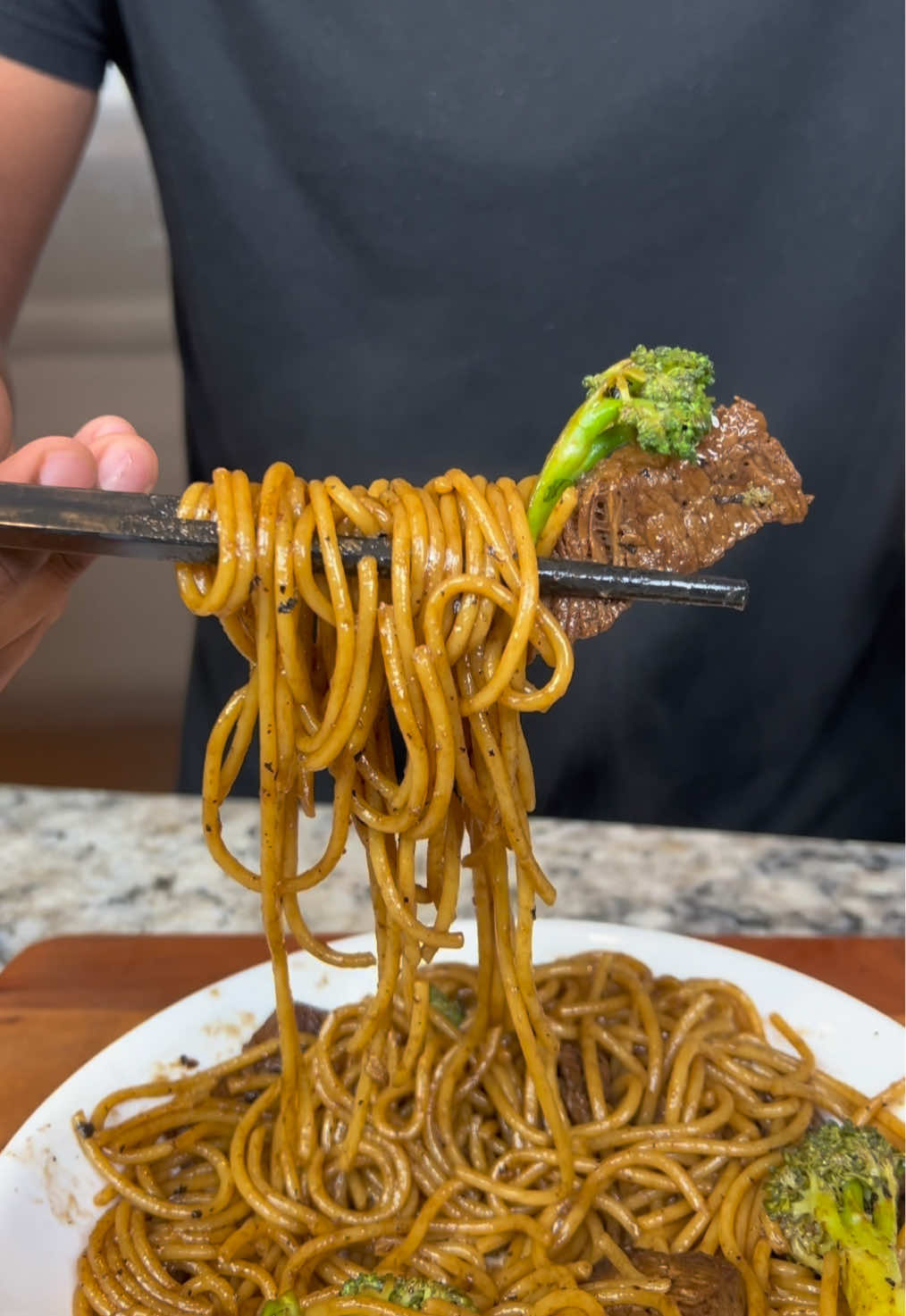 A post by @eatwitzo on TikTok caption: Beef and Broccoli Lo Mein  Beef and broccoli is easily a top 5 takeout dish! Add lo mein & its on another level! Whats your favorite takeout meal?  Full ingredient list:  1 lb steak sliced  2 medium broccoli crowns  2 garlic cloves  1/4 onion chopped  For sauce:  2-3 tbsp hoisin sauce 1-2 tbsp rice wine vinegar  1/4-1/2 cup soy sauce 1-2 tsp toasted sesame oil 1/4 cup honey  2 tsp cornstarch + 3 tsp water (cornstarch slurry) 1-2 tsp white pepper  1-2 tsp onion powder  1/2 tsp ground ginger  Spaghetti or chow mein noodles #lomein #beefandbroccoli #eatwitzo 