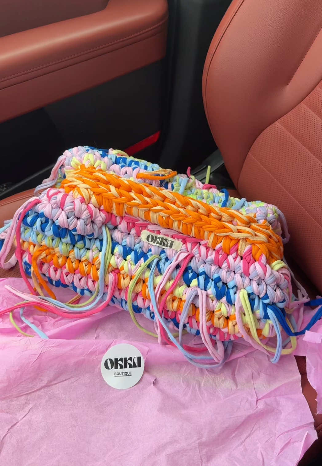 A post by @usernamelotus on TikTok caption: my clutch bag from Greece just came in. 💝 @okka.boutique 