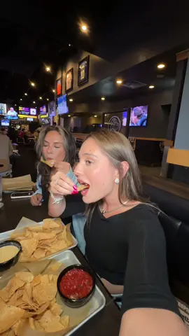 A post by @kaitlin_reagan on TikTok caption: Yapping with the girls over bottomless apps ❤️ Head to Buffalo Wild Wings for bottomless apps for just $9.99 all day every day for a limited time.  Mix & match unlimited mozzarella sticks, fried pickles, hatch chile queso, onion rings, chips & salsa. Dine-in only @Buffalo Wild Wings  #bwwpartner
