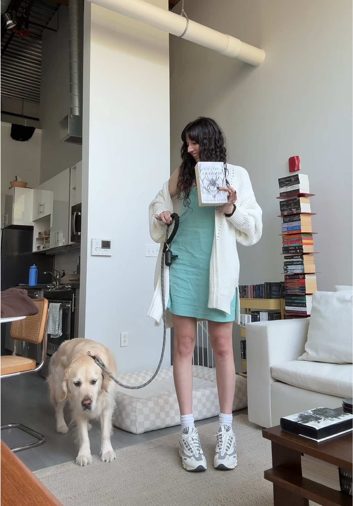 A post by @mariannasreads on TikTok caption: Dog, outfit, and book of the day. Wesley wasn’t having it. #BookTok #outfit #ootd #goldenretriever 
