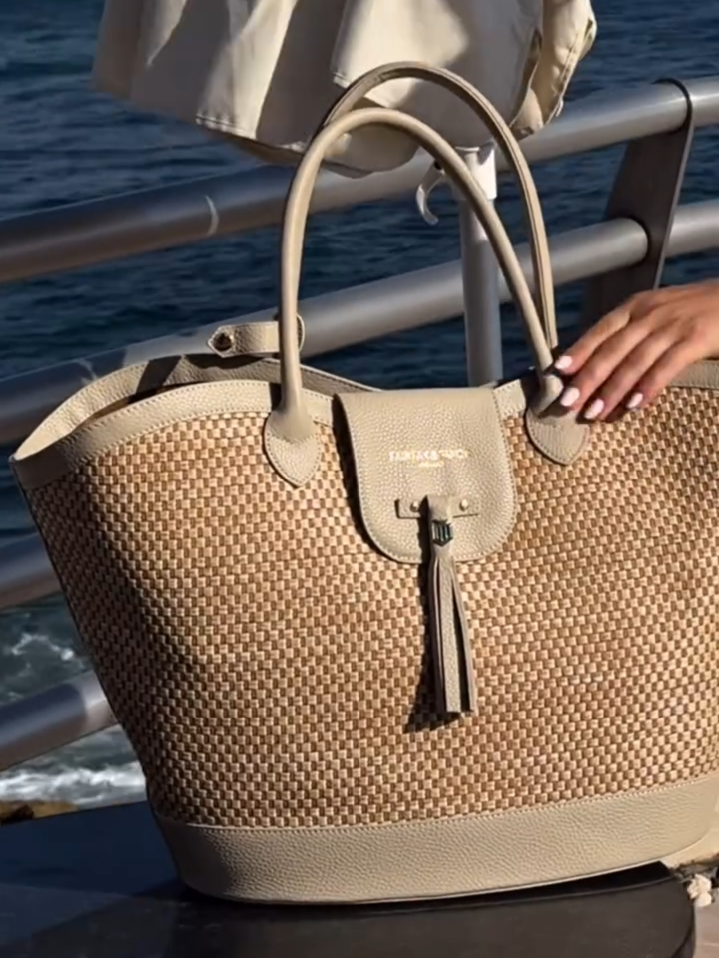 A post by @fairfaxandfavor on TikTok caption: The basket bag that fits everything and every holiday occasion✨ How gorgeous does @lisaandrenilssonn look with our Large Stone Windsir Basket Bag in tow?  #holidayoutfit #basketbag #summeroutfits #FairfaxAndFavor #OOTD #theperfectoutfit #summerstyle #styleinspo #summerevent #eventstyle #CountryStyle #luxuryfashion #SummerOutfitInspo #ElevatedEveryday #holidaylook #holidaystyle