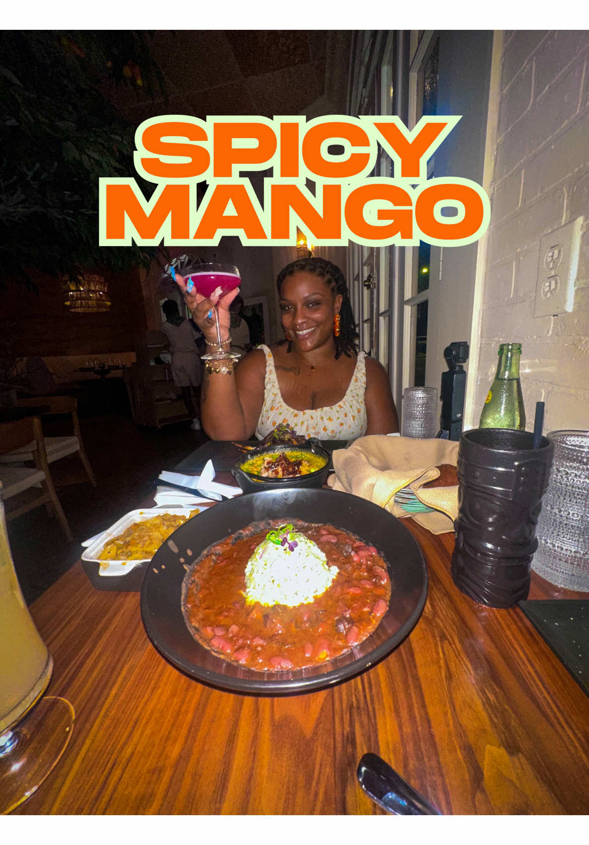 A post by @bukutriece on TikTok caption: Am I in the Carribean or New Orleans? NOLA’s newest carribean fusion restaurant!  Spicy Mango is located right on Frenchmen St where you can grab a drink and listen to live music after you eat! #neworleans #dinner #bukutriece 