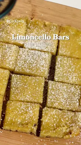 A post by @cocktails on TikTok caption: A picnic sweet treat but with a boozy twist. 🍋✨ Crust Ingredients: - crushed oatmeal cookies or graham crackers (about 1 & 1/2 cups crushed) - 3 tbs. melted butter Filling Ingredients: - 1 & 1/2 cups sugar - 4 tbs. AP flour - zest of 1 lemon - dash of vanilla extract - 4 eggs - 1/3 cup fresh lemon juice - 1/2 cup limoncello Recipe: 1. Crush oatmeal cookies (or graham crackers) until finely crumbled, then combine with melted butter 2. Press into a greased and lined baking dish 3. Bake crust for 20 minutes at 325F 4. Prep filling by whisking sugar, flour, and lemon zest together. Then mix in vanilla, eggs, lemon juice, and limoncello 5. Once crust is done baking, remove from oven and pour filling into crust 6. Bake for 18-20 minutes at 325F 7. Once done baking, remove from oven and chill in the fridge for 2 hours while sealed with Saran wrap 8. Finally, slice and garnish with powdered sugar to serve #lemonbars #limoncellobars #limoncello #picnic #dessert #recipe #boozy #summer