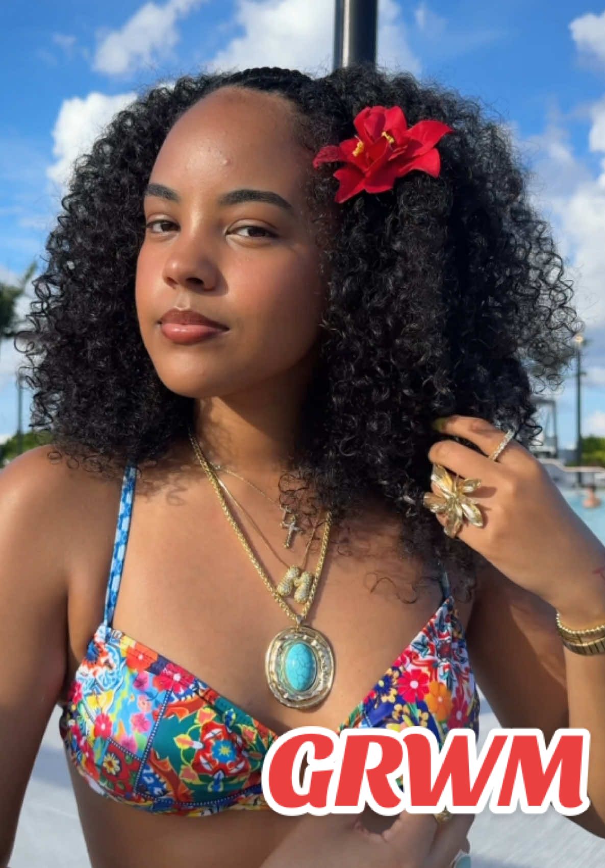 A post by @michixo__ on TikTok caption: grwm poolside 🌺🌴🌊💄✨ find everything on my LTK :)  #curlygirl #braids #braidstyles #curlyhair #Summer #hairstyle #pool #naturalhair #inspiration #flowers #grwm #beauty #makeup @amika @Curlsmith US @The Face Shop US @Vacation Inc. @IT Cosmetics @Armani beauty @LaCroix Sparkling Water @Rare Beauty @Morphe Cosmetics @elfcosmetics @makeupforever @Clarins USA @Milani Cosmetics 
