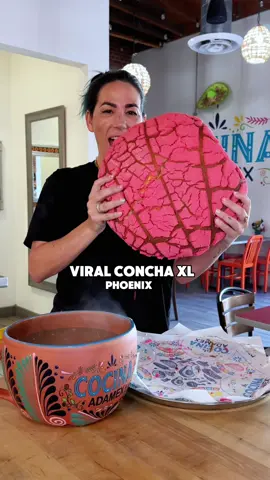A post by @azfoodie on TikTok caption: XL Concha pairs perfectly with an XL Cafe de olla at @Cocina Adamex .  These XL conchas are a larger-than-life twist on the classic Mexican sweet bread. They’re perfect for special occasions or as a treat for yourself! Made fresh daily with traditional ingredients, their flavors, include vanilla, chocolate, and strawberry. Must preorder. 📍 416 N 7th Ave Phoenix, AZ  85007 #azfoodie 