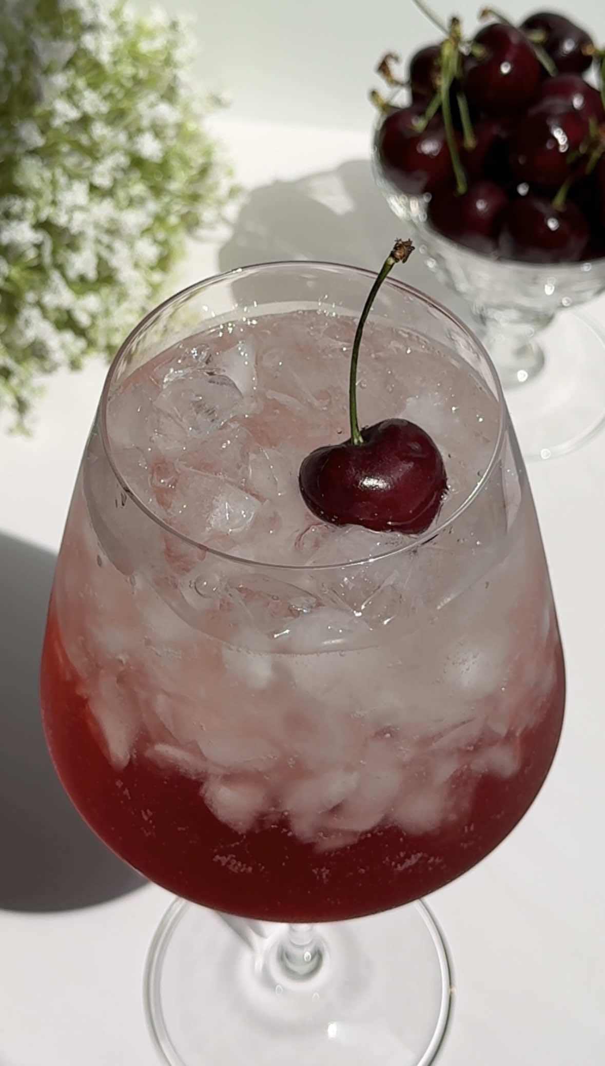 A post by @cocktails on TikTok caption: And a cherry on top to level up your next Aperol spritz.🍒🥂 Ingredients: - juice of 7-8 cherries crushed and strained - 2 oz. Aperol - 3 oz. prosecco - 1 oz. club soda - cherry to garnish #cherry #aperolspritz #aperol #spritz #summer #cherryaperolspritz #cocktail #drink