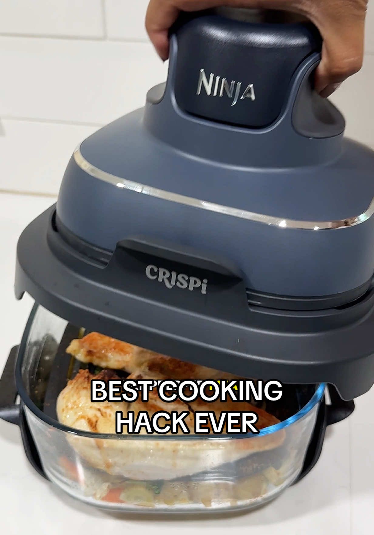A post by @bettyyannhill on TikTok caption: SHUT THE FRONT DOOR 👏🏽 easiest YUMMY dinner ever! To think I can plan out a few days of meals at once, store them in the fridge, then just POP this thing on top of the glass container & have dinner 😩👏🏽🤌🏽 @Ninja Kitchen did NOT miss! Seriously you'll fall in love, even if you're like me & don't like to cook 🤪❤️ #ninjacrispi #ninjakitchen #ninjaairfryer #ninjacrispirecipes #glassairfryer #easydinnerideas #tiktokshopcreatorpicks #dealsforyoudays #easymeals #easymealprep 