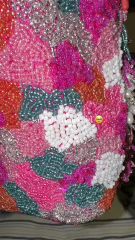 A post by @ucancallmevee on TikTok caption: My new purse 🥹🥰 #fyp #purse #handbag #handbeaded #fyp
