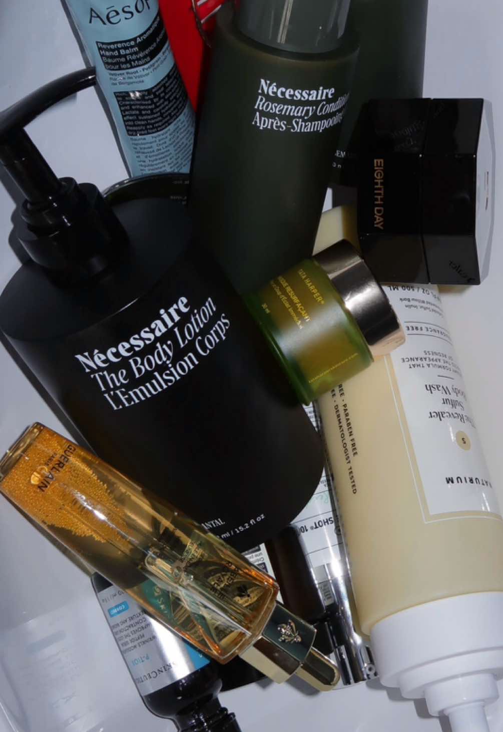 A post by @theedwardpark on TikTok caption: June Favorites are here! Featuring: @Guerlain @Nécessaire #eighthdayskin @REFY @Naturium @UNIQLO USA  #favorites #monthlyfavorites #skincarefavorites #beautyfavorites 