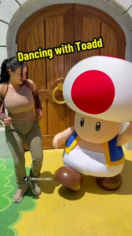 A post by @tinaexplorez on TikTok caption: Toad is such a vibe 😂 #fyp #viralvideo #viral #OOTD #universalstudioshollywood #supernintendoworldhollywood #jurassicparkrebirth 