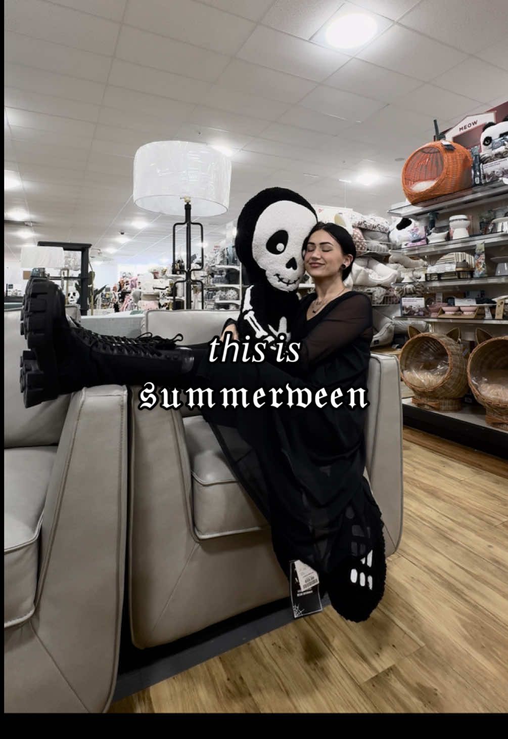A post by @evdreadful on TikTok caption: summerween is upon us, only means halloween is right around the corner 🧡🎃 #halloween #summerween #codeorange #spookyseason #tistheseason #OOTD #shopping #altgirl #gothgirl #aesthetic