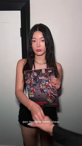 A post by @katseyeworld on TikTok caption: my name is BEAUTIFUL CHAOS and i’m really glad to meet you #KATSEYE #KATSEYE_BEAUTIFULCHAOS #BEAUTIFULCHAOS 