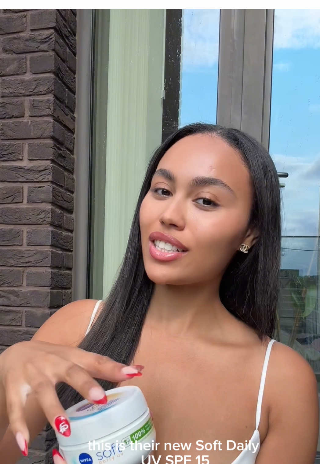 A post by @3llathomas on TikTok caption: ad How I keep my skin glowy & protected with NIVEA Soft Daily UV SPF15 🩵 @NIVEA UK @Superdrug  #SoftSkinDaily #GlowingSkin #SoftWithBenefits #SummerMustHave