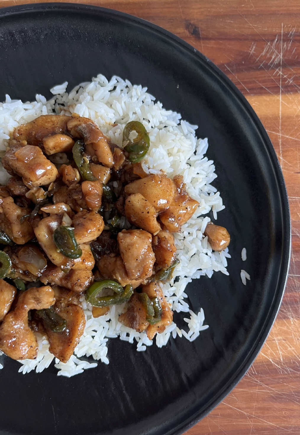 A post by @britscookin on TikTok caption: Jalapeño chicken is one of my most recreated recipes, and I’m so happy y’all love it just as much as we do! It’s a summer staple around here, so let’s run it back! Ingredients: 	•	4 lbs boneless, skinless chicken thighs (cut into bite-sized pieces) 	•	1 tbsp black pepper 	•	1/2 tbsp garlic salt (or regular salt) 	•	Cornstarch (enough to coat the chicken—about 3–4 tbsp) 	•	2–3 tbsp avocado oil (or any cooking oil) 	•	1 large yellow onion, sliced 	•	4 fresh jalapeños, sliced (1 per pound of chicken—adjust to taste) Sauce: 	•	1/2 cup brown sugar 	•	1/2 cup soy sauce 	•	1/2 cup water 	•	3 tbsp minced garlic Instructions: 	1.	In a large bowl, season the chicken with black pepper, garlic salt, and a generous sprinkle of cornstarch. Toss until evenly coated. 	2.	Heat avocado oil in a large skillet or wok over medium-high heat. Brown the chicken in batches, making sure not to overcrowd the pan. Cook until golden and cooked through. Set aside on a paper towel-lined plate. 	3.	In a separate bowl, whisk together brown sugar, soy sauce, water, and minced garlic. Set aside. 	4.	In the same skillet, sauté sliced onions and jalapeños until the onions are translucent. 	5.	Return the chicken to the pan, pour in the sauce, and stir to coat everything evenly. 	6.	Let the sauce simmer for a few minutes until it thickens up and coats the chicken nicely. 	7.	Serve hot over white rice! Optional: Top with green onions or sesame seeds if you’d like.