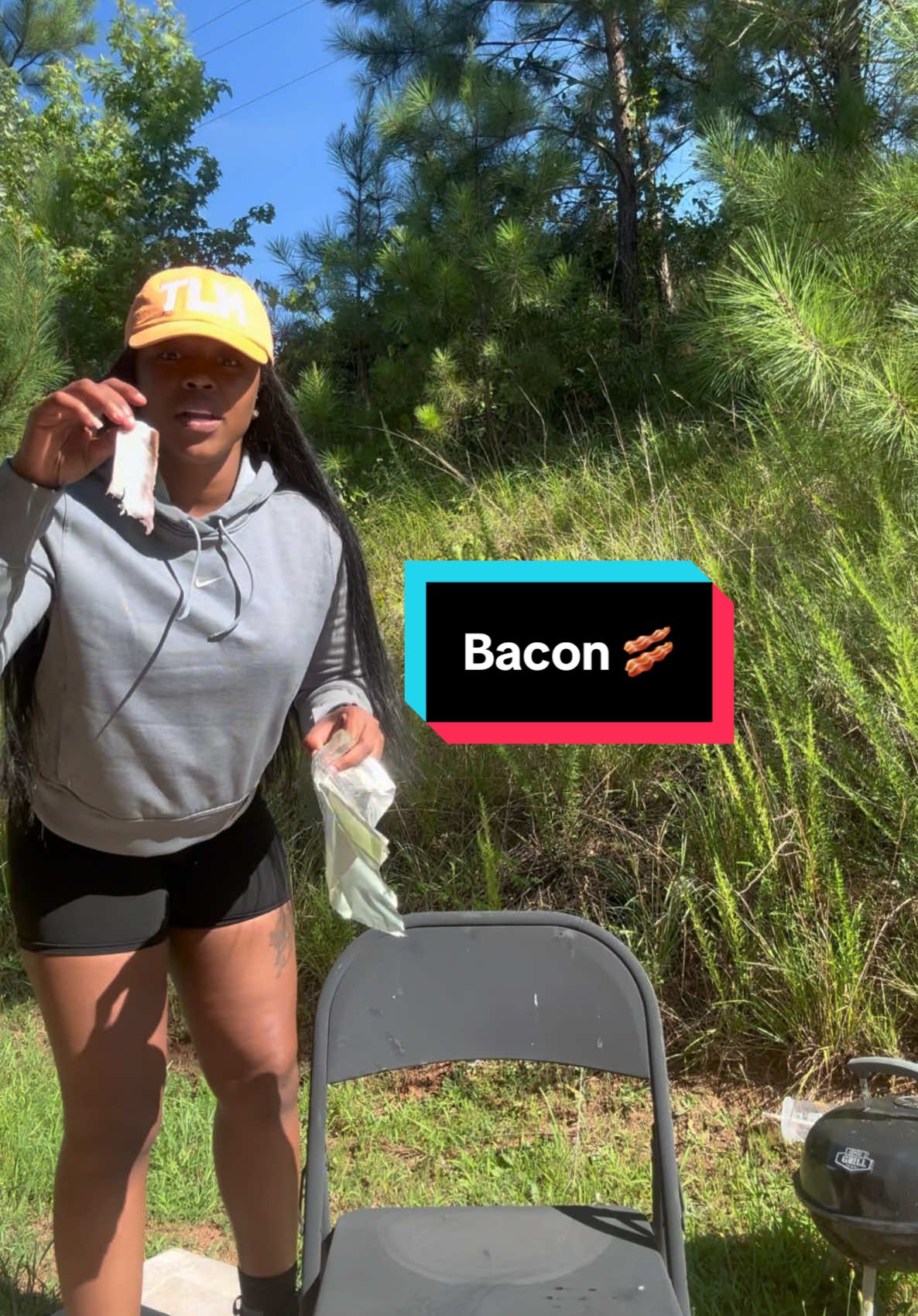 A post by @chymarron_official on TikTok caption: I just cooked Bacon 🥓 outside in Florida Heat 😳